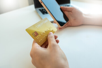 Business people hold credit cards and use smart phone in online shopping Business idea.
