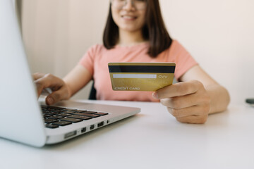 business hands holding credit card and using laptop computer for online shopping, Online payment and shopping