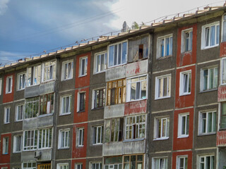 Fototapeta na wymiar Soviet architecture. Ust-Kamenogorsk (Kazakhstan) Apartment building. Soviet architectural style. Residential building. Soviet built multistory apartment building