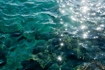 Fototapeta na wymiar Texture of sea water with sun glitters 