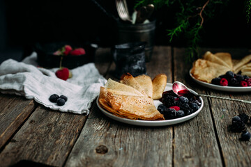 Thin Pancakes with jam and berries. Breakfast. Maslenitsa holiday