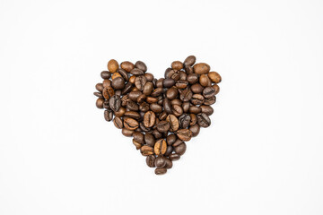 a photo of coffee beans arranged in a heart of Valentine's Day on a white background