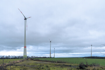Fototapeta na wymiar Wind turbines in the field