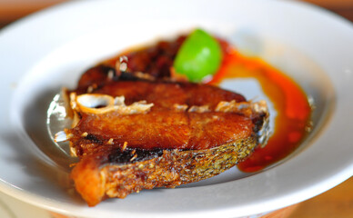 Fried fish on white plate