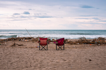 Waves pushing plastic waste to the beach