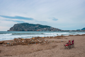 Waves pushing plastic waste to the beach