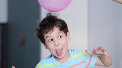 surprised cheerful boy with thorns in his hair without static electrification. Physics, electrical...