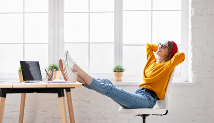 Relaxed freelancer resting on workplace