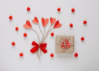 Flat lay Happy Valentine's Day photography with gift box and paper origami heart. Romantic greeting card.