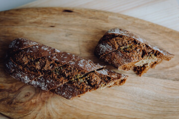 Baked garlic baguette bread with herbs and tomatos