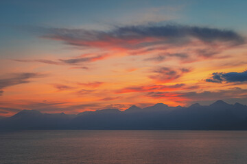 Beautiful golden sunset over the sea and mountains in Antalya, Turkey