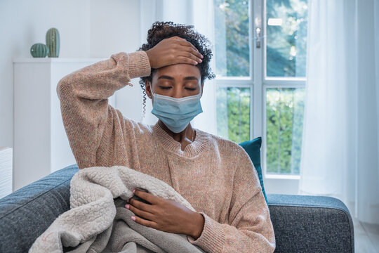 Ill african woman portrait with flu infection at home