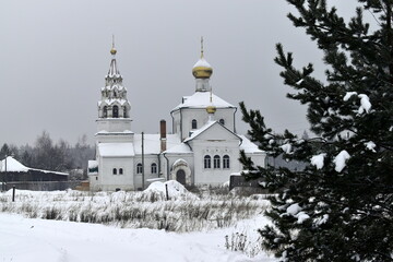 Orthodox church in the village in winter