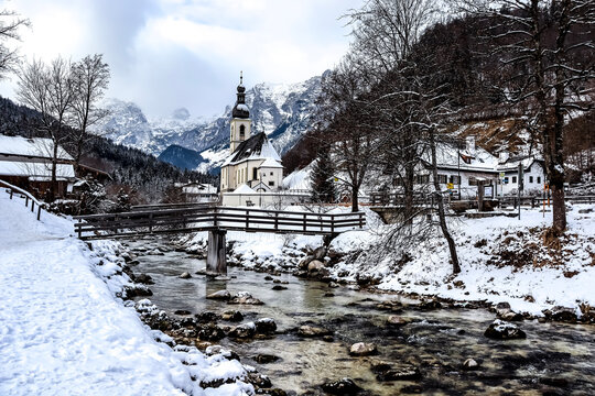 Historic church in Ramsau in winter, in the German national park Berchtesgaden, not far away from Königssee and Salzburg. The little chapel and the mountains in the background are a famous landmark.