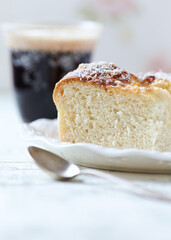  Simple yeast cake on bright background. Close up.