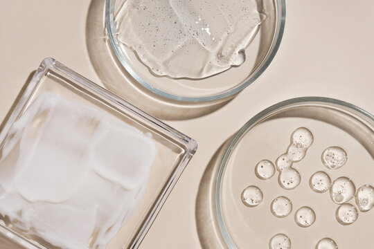 Drops and smears of various cosmetics. Assortment of cosmetics hyaluronic acid drops, cream and gel smears.