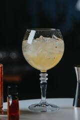 Cocktails with champagne in wine glasses on the bar table in the pub or restaurant with the bartender. 