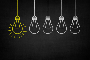 hanging yellow bulb with other white bulbs (1)