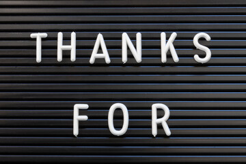 Thanks For in white text on a black striped background for thanking and appreciation.