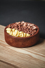 Wooden Bowl with different sorts of quick breakfast cereal products