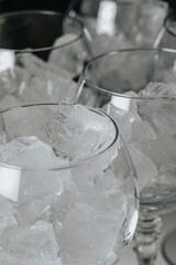 Ice in a glass of wine prepared for a special cocktail for a bartender's bar or restaurant.