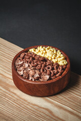 Wooden Bowl with different sorts of quick breakfast cereal products