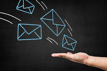 chalkboard with blue envelopes drawn hand