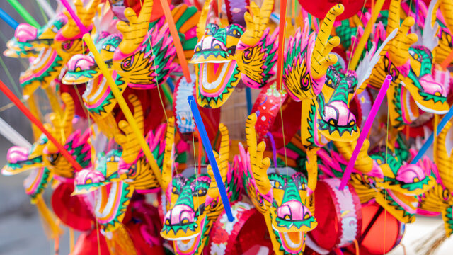 A lot of dragon images made with beautiful paper and colorful, blurred background on New Year Chinese New Year.