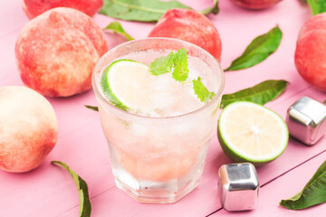 summer cold alcohol beverage iced peach bellini cocktail with mint leaves (1)