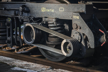 Truskavets, Ukraine - January 2021: Wheels of locomotive CHS7 with a freight train awaiting departure on the platform of the railway station. Ukrzaliznytsia. Ukrainian railways.