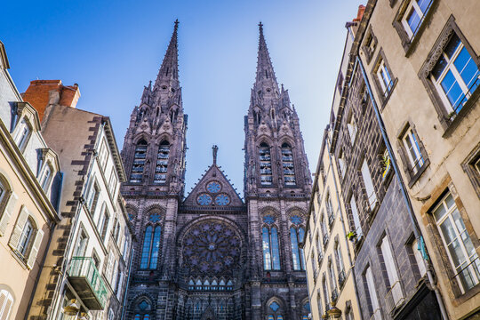 View, from the rue des Gras, on the facade of the gothic cathedral of Clermont-Ferrand, in Auvergne, France 