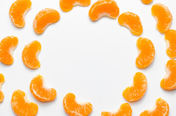 Citrus composition. Consists of tangerine slices on a white background. Top view, flat lounger, copy space.