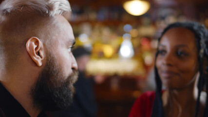 Happy romantic smiling people having date in restaurant.