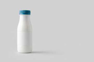 White plastic yogurt or milk bottle mockup with copyspace.