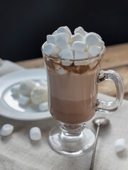 Hot chocolate with marshmallows on a wooden table. Good morning.   Homemade hot  chocolate on a wooden table.  