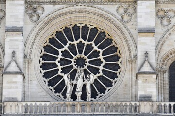Fototapeta na wymiar Details facade of the famous Notre-Dame cathedral, in Paris, France.