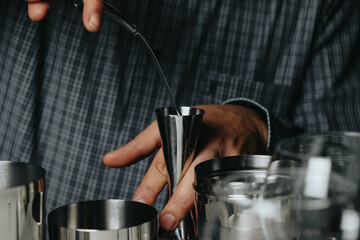 Cocktails with champagne in wine glasses on the bar table in the pub or restaurant with the bartender.