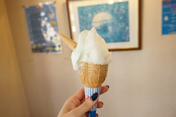 Woman holding Italian gelato or gelatto ice cream  - イタリア ジェラート 女性 手