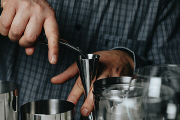 Cocktails with champagne in wine glasses on the bar table in the pub or restaurant with the bartender.