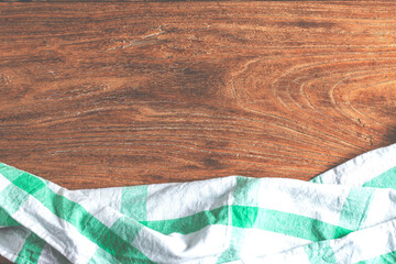 empty table covered with tablecloth brown cement wall background