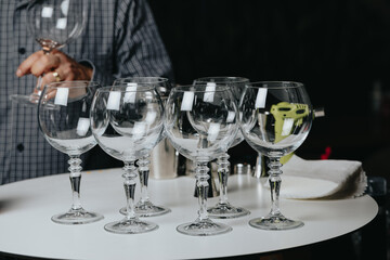 Background image with bartender prepared glasses for champagne cocktail on a table in bar or restaurant.