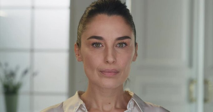 Beauty shot of mature woman with perfect face skin just cleaned from impurities ready for moisturizing anti wrinkle day or night cream is smiling in camera. Concept of skincare, cosmetics, healthcare.