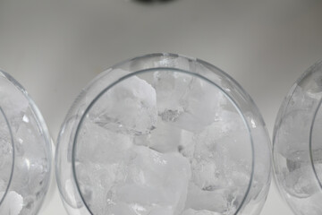 Ice in a glass of wine prepared for a special cocktail for a bartender's bar or restaurant.