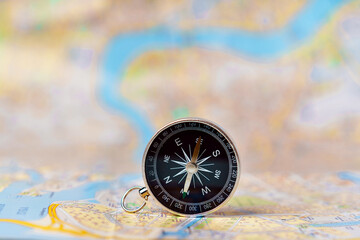 Compass standing vertically on the map of Saint Petersburg, concepts of travel, tourism and research, copyspace