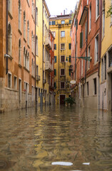 Obraz na płótnie Canvas Venice, Italy - 1 November 2018: acqua alta, view on a street has been flooded by waters rising 156 cm