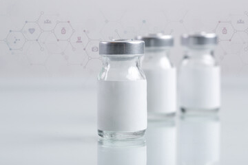 Close up image of vaccine or injection bottles with blank white label.  Vial bottle mockup....