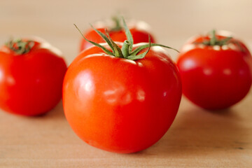 Close-up of red fresh biological tomatoes. Fresh food for healthy eating and cooking. full frame with selective focus
