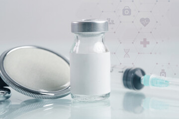 Close up image of vaccine or injection bottles with blank white label.  Vial bottle mockup. Science, vaccination, immunization, health care and medical concept. 
 