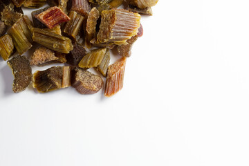 Dried rhubarb candied fruits. Candied rhubarb on a white background. Dry rhubarb close - up macro photography. Rheum.