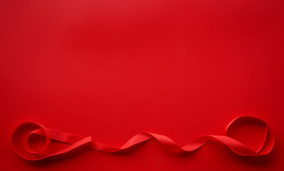 Obraz na płótnie Canvas Red paper with red satin ribbon frame, Valentine or Gift background 